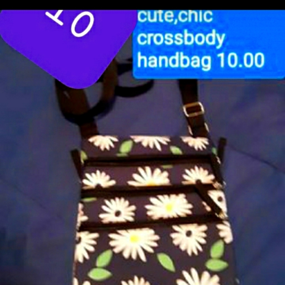Small crossbody flower purse. Small but functional for what you need to carry.